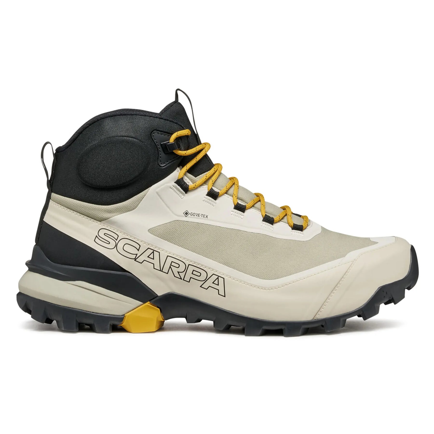 Beige hiking boot with yellow accents and 'Scarpa' branding on a white background