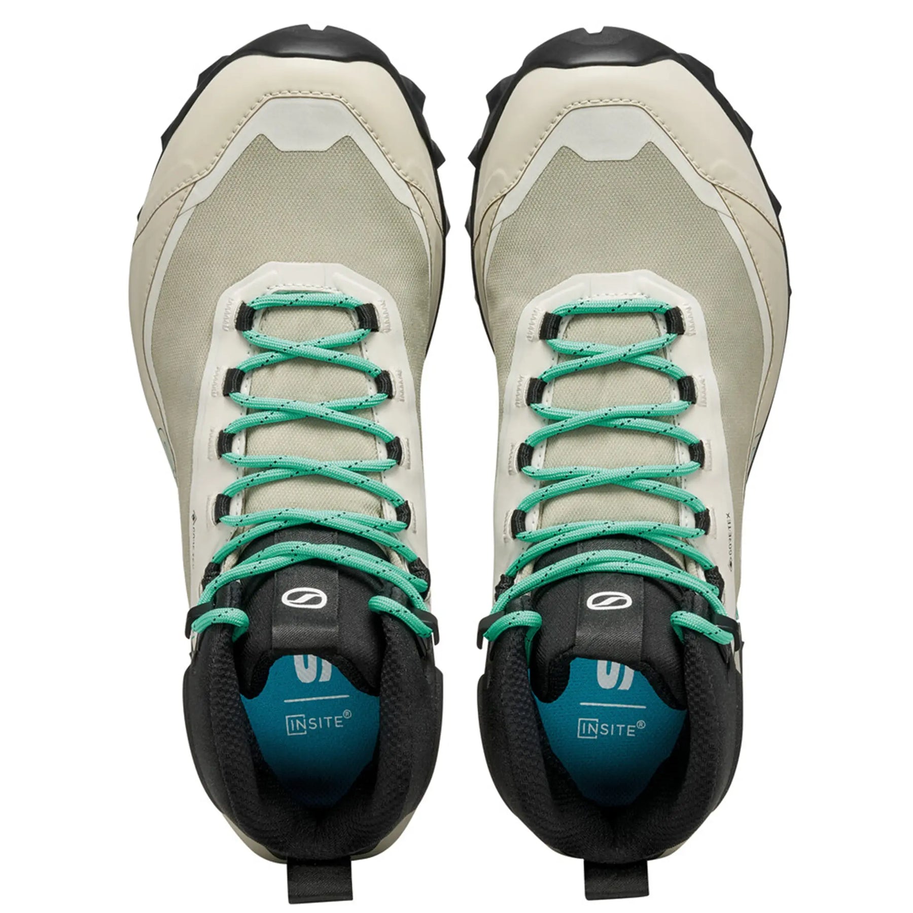 Pair of hiking boots with green laces on a white background