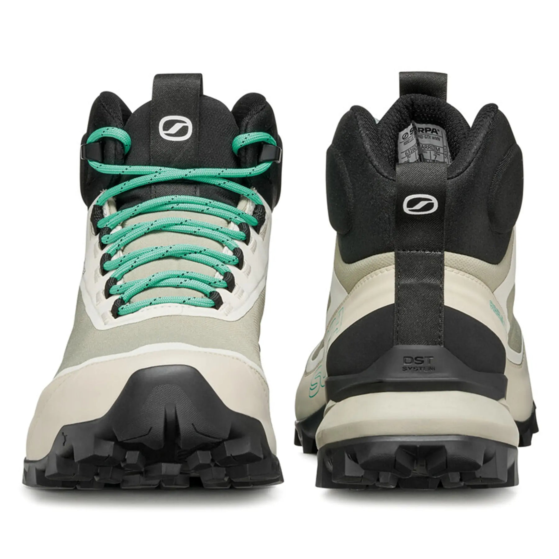 Pair of hiking boots with green laces on a white background