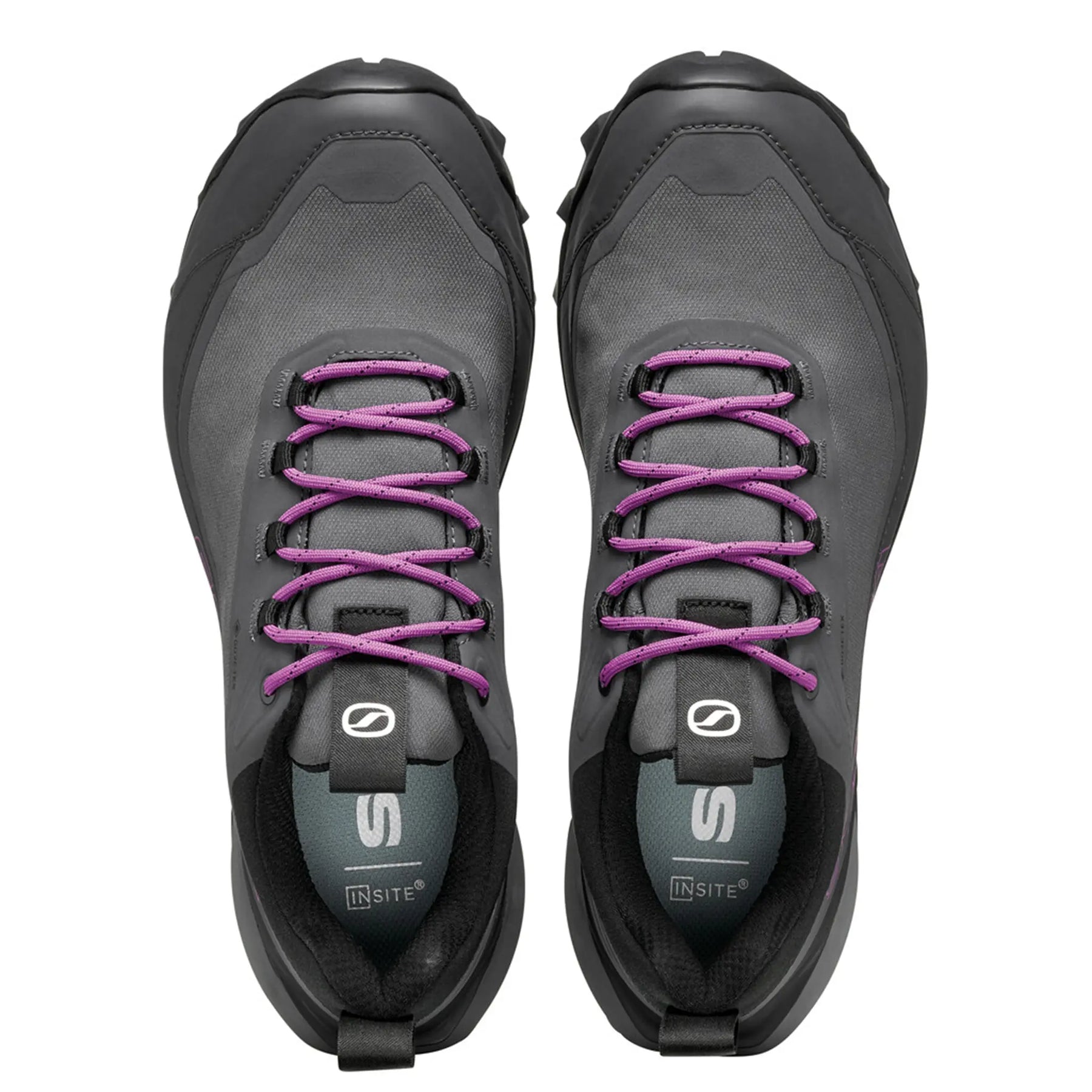 Pair of gray athletic shoes with purple laces on a white background