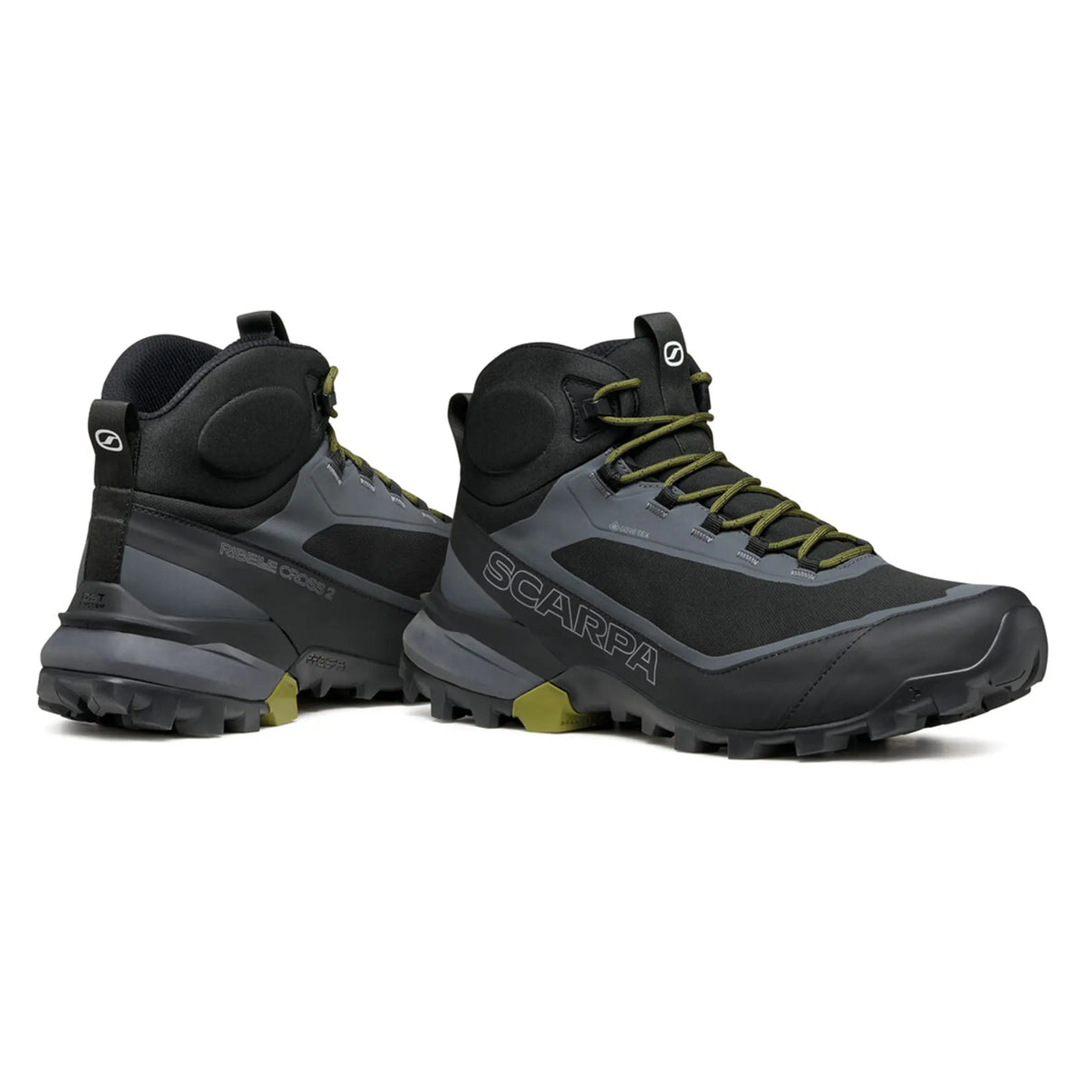 Pair of black hiking boots with green accents on a white background