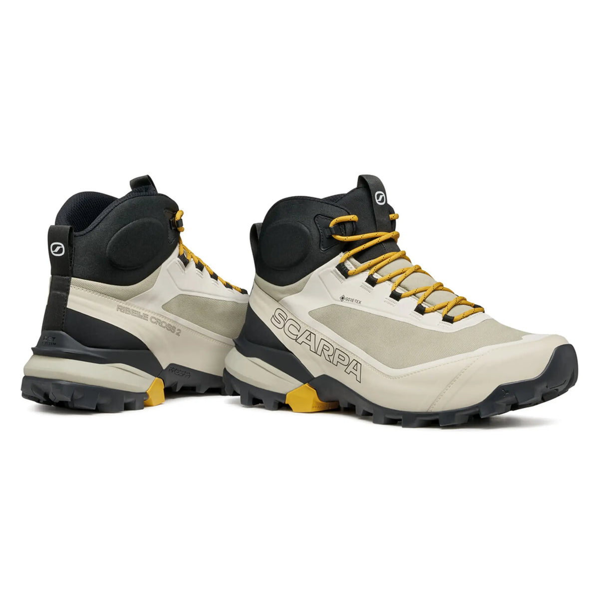 Pair of beige and black hiking boots with yellow accents on a white background, featuring the Scarpa brand.