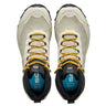 Pair of hiking shoes with yellow laces on a white background
