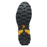 Close-up of a shoe sole with tread pattern and brand logo on a white background