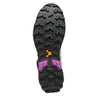 Close-up of a hiking shoe sole with purple accents on a white background
