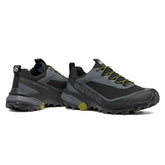 Pair of black and gray hiking shoes with green accents on a white background