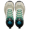 Pair of hiking boots with green laces on a white background