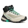 Beige lightweight hiking boot with green laces and sole on a white background