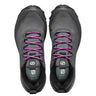 Pair of gray athletic shoes with purple laces on a white background