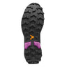 Close-up of a shoe sole with tread pattern and brand logo on a white background